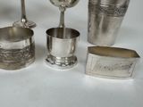a lot of silver items that are on a table
