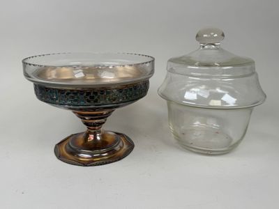 a glass bowl and a glass jar sitting next to each other