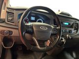 dashboard view of a car with a steering wheel and dashboard controls