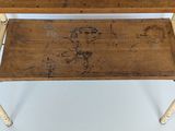 a small wooden table with a wooden top and metal legs