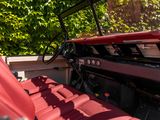 a red leather seat in the back of an old car