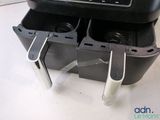an image of a toaster with two cups in it