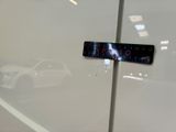 a sticker on the door of a white car