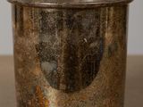 a silver cup that is sitting on a table
