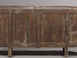 an old wooden cabinet with two doors on it