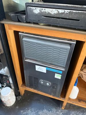 an image of a microwave sitting on top of a wooden cabinet