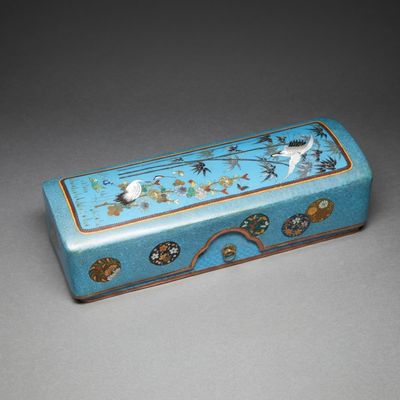 an image of a blue box with birds and flowers painted on it