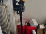 a camera that is sitting on a tripod in a room