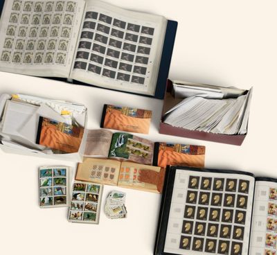 a lot of stamps and stamps in a book on the table