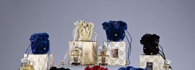 a lot of small bags of perfumes on a table