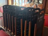 a lot of baseball bats that are on a table