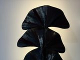 a black sculpture that is sitting on a table