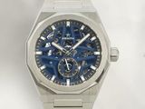 a close up of a watch with a blue dial