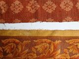 two pieces of fabric on the floor next to each other