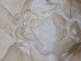 a close up of a statue of a man with a hat on