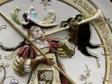 a clock with a picture of a man riding a horse