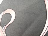 a black bag with a pink bow on it