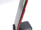 a cell phone that is sitting on a stand