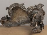 a silver figurine of an elephant on a table