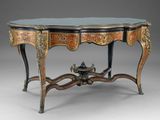 an ornately decorated table with a glass top