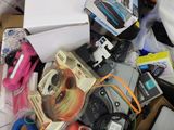 a pile of assorted items in a bin on the floor