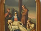 painting of jesus laying on the cross in front of a group of people