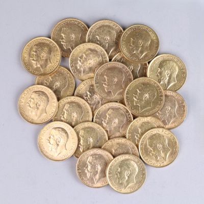 a pile of gold coins on a white surface