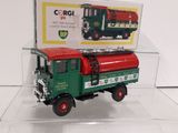 a green and red truck with a box on the back of it