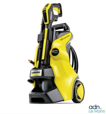 a yellow pressurer with a hose attached to it