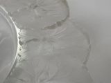 a glass plate with a flower design on it
