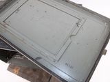 a metal box that has a metal door on top of it