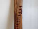 a tall wooden pole with a clock on top of it