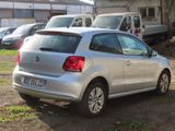 a silver car that is parked in a lot