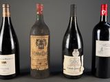 three bottles of wine are lined up on a table
