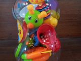 a jar filled with plastic toys on a wooden table