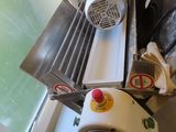 a machine that is sitting on a counter next to a window