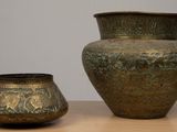 two vases that are sitting on a table