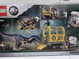 a box of legos with a picture of a t - rex on it