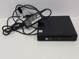 a laptop computer with a power cord attached to it