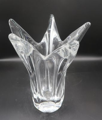 a glass vase that is sitting on a table
