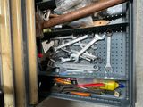 many tools in the toolbox of a garage