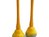 pair of yellow and blue vases sitting on a white surface