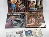 three books of children ' s books, including a picture of a man and a woman on a boat
