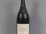 a close up of a bottle of wine on a table