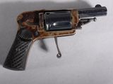 a toy gun that is sitting on a white surface