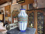 a vase sitting on top of a table in a room