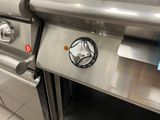 a close up of a stainless steel oven in a kitchen