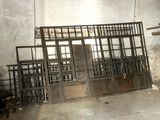 a room that has a bunch of old windows in it