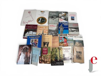 a lot of books that are sitting on a table