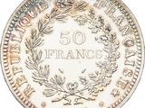 a close up of a coin with a wreath on it